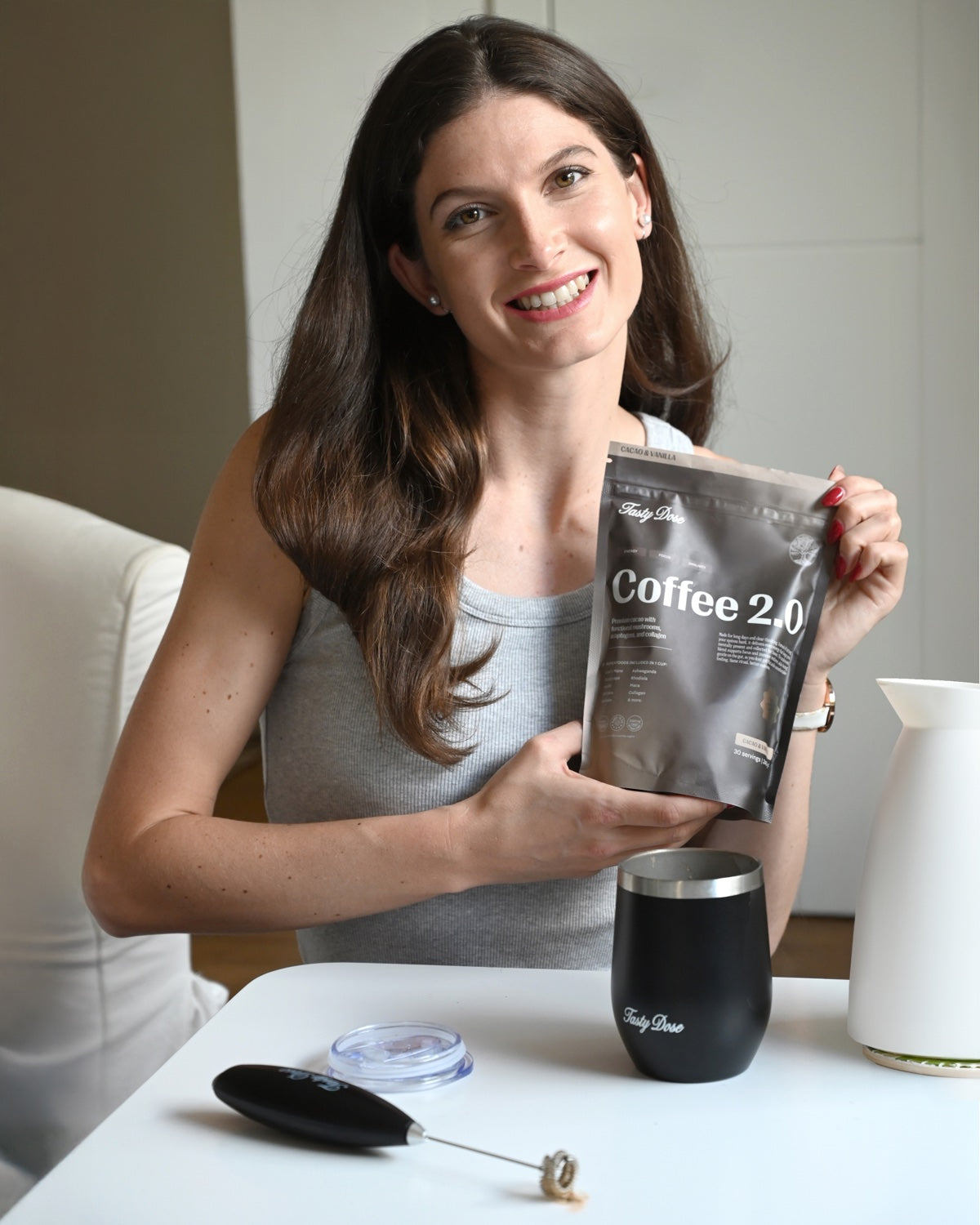 Real customer with her Coffee 2.0 pouch, frother, scoop and Tasty Dose tumbler